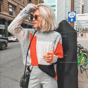 Multi-colored, multi-knit sweater